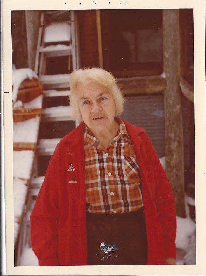 Dorothy Molter in her later years standing outside in the snow. 