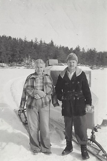 Dorothy standing outside next to Bill Berglund during the winter months.