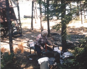 Dorothy making root beer outside of her summer tent