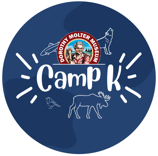 blue circle with museum logo and the words camp k with outlines of different wildlife